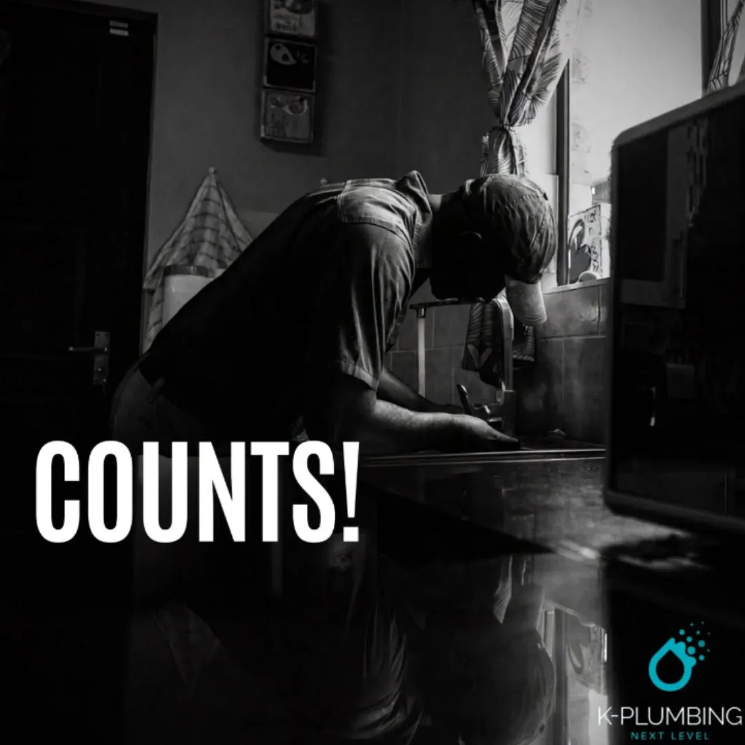 K-Plumbing professional artisan plumber meticulously repairing a kitchen sink installation, with text reading COUNTS!.